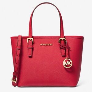 MK extra-small jet set travel tote with zippered top. Excellent condition.